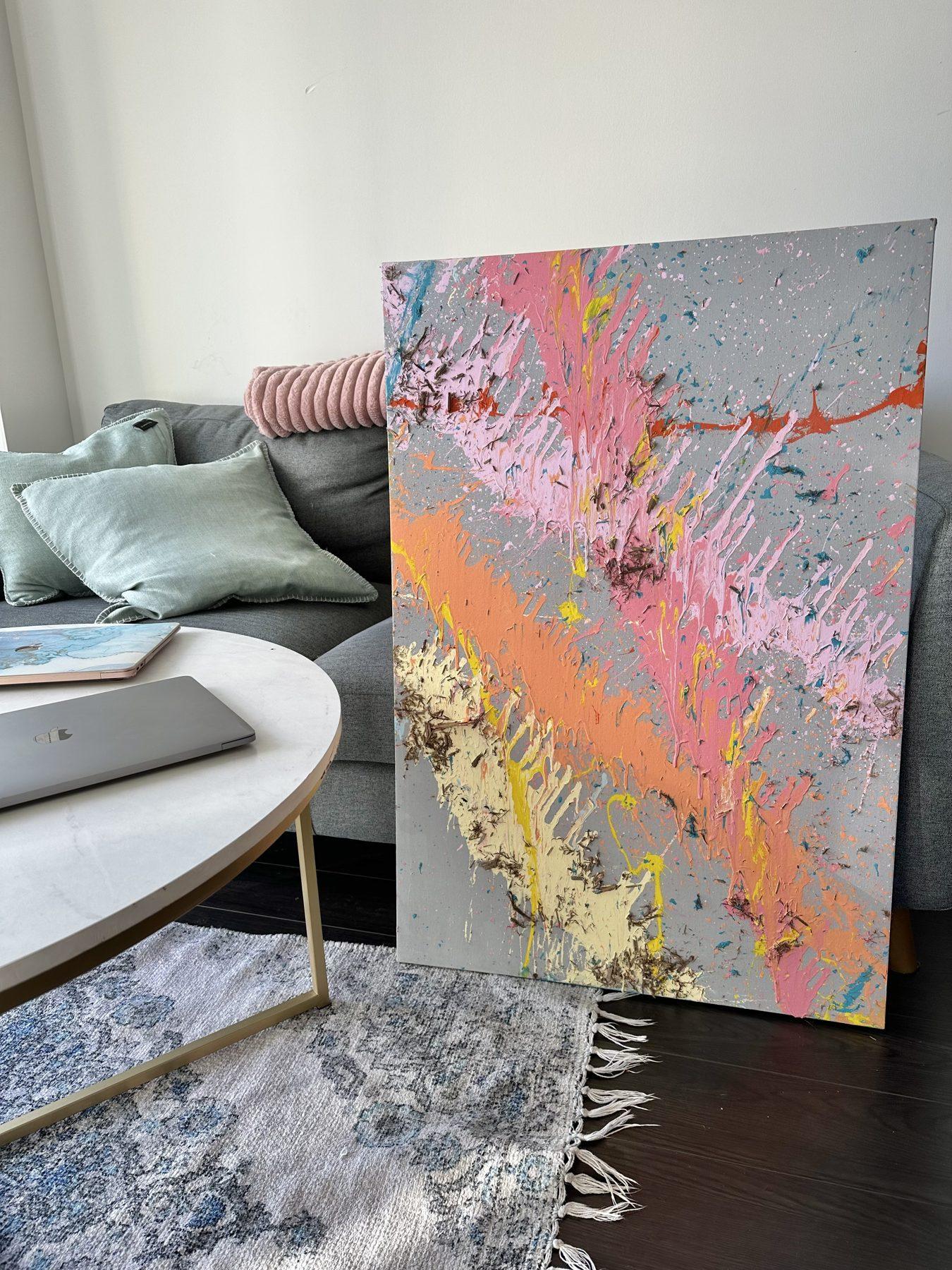Milkshake No. 1 leaning against a living-room wall, showing the scale of the canvas