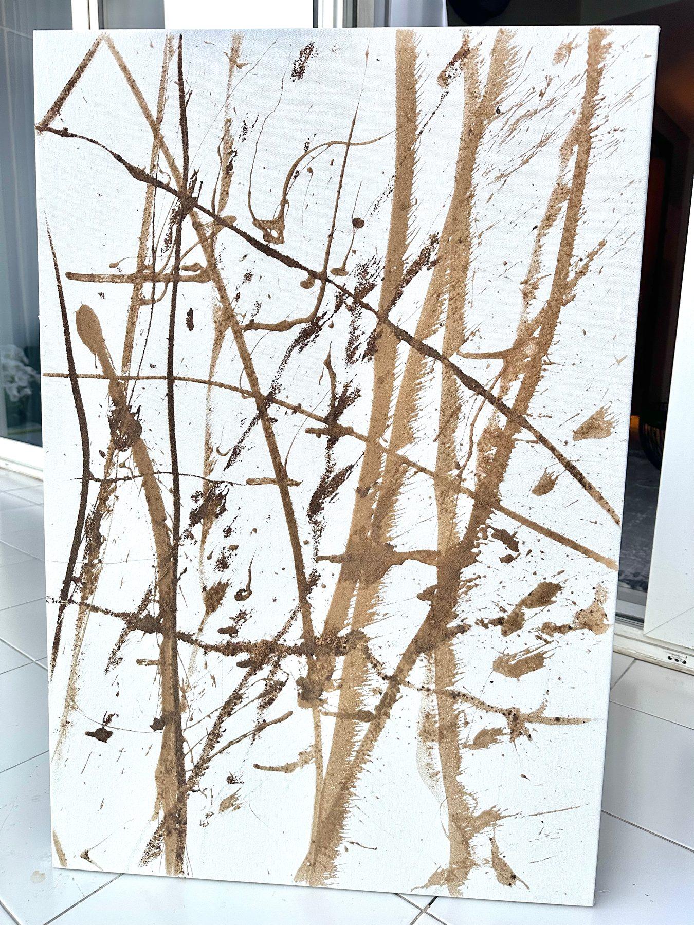 Time Breeze III by Alejandro Sánchez: tall, wind-blown strokes of sand and brown paint on a white canvas